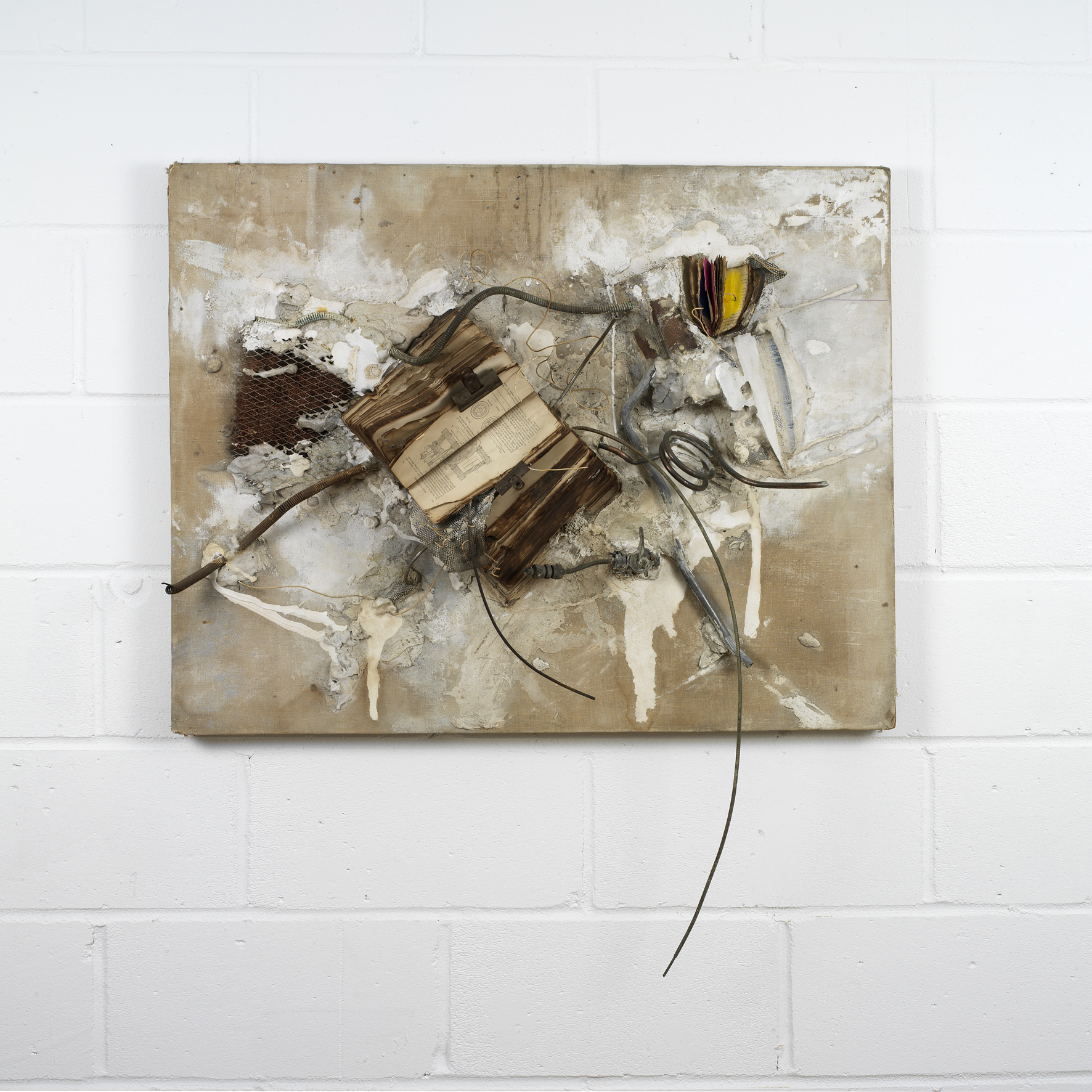 Philosophy and the practice of (1960) Singed and painted books, metal rust, clips, copper tubes, electrical wires, wire-mesh, electrical instrument panel, plaster on canvas and hardboard. Photo: Ken Adlard (Distress of a Dictionary 4)