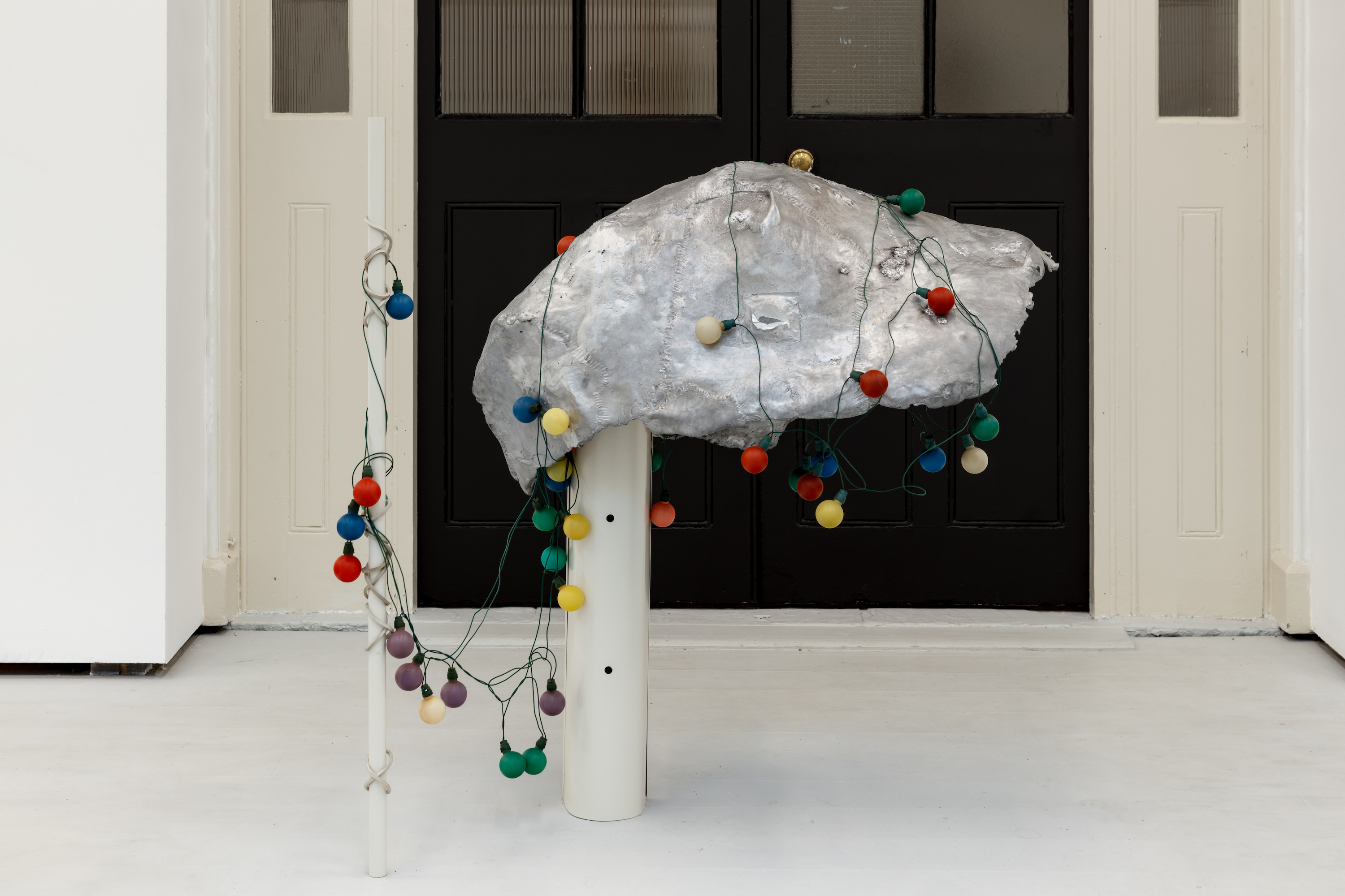 Georgia Kerr, Bag Car, 2026. Cast aluminuim, steel, rubber, paint and light bulbs. Photo: Jack Elliot Edwards (CHELSEA ARTS CLUB TRUST AWARDS SALON 2026 0)