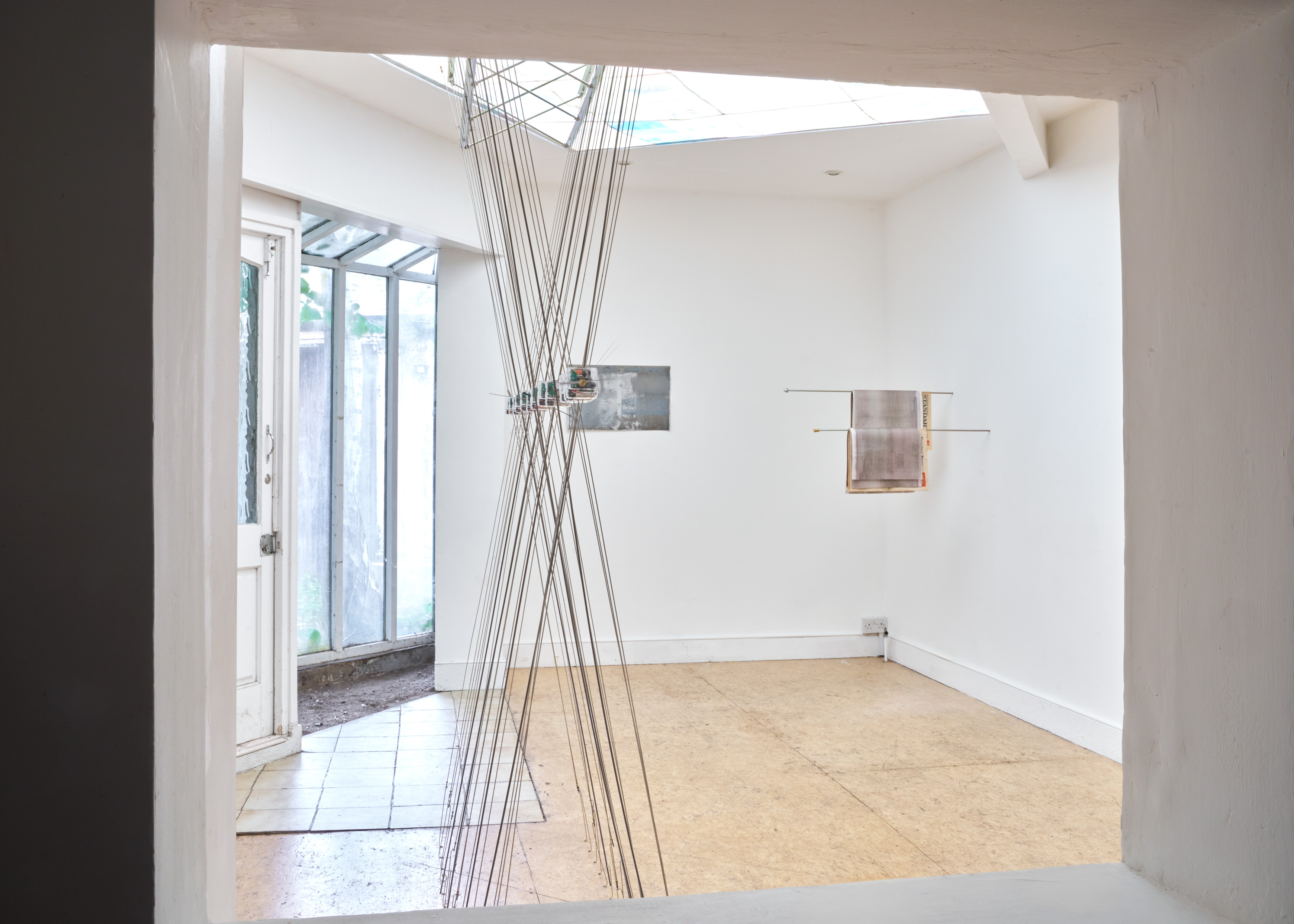  Eloise Hawser, Left to right : Mechanical Coping, Steel, clocks. 2025. 17-09-2024, Found lithographic plate. 2025. Opinions, Steel, newspaper. 2025. Photo : Peter Otto (ELOISE HAWSER: 15)